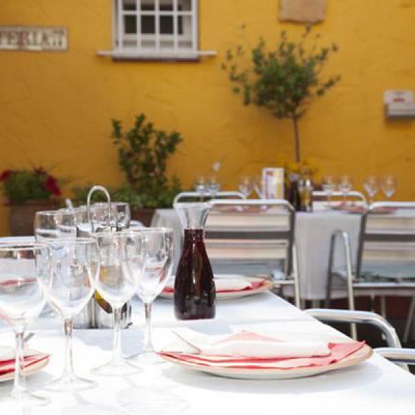 Table setting with wine on the restaurant's terrace